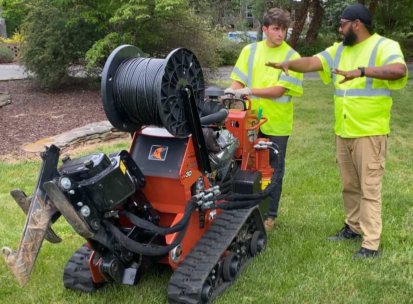 National OnDemand technicians work on installing fiber in residential area for High-Speed Internet