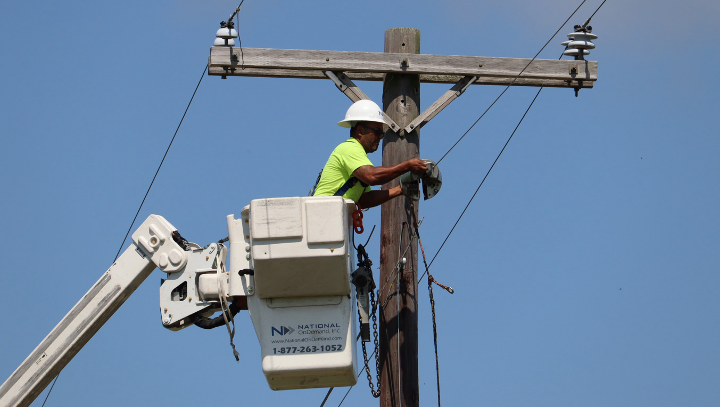 How Your Location Decides Your Internet Speed Results Aerial Lineman lashes fiber optic cable between utility poles