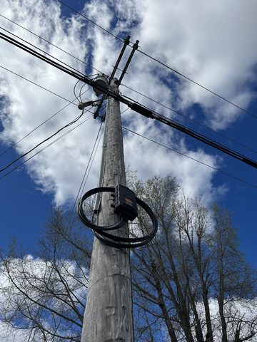 Fiber cable hangs from a pole just before a customer gets a broadband connection in Oxford, Miss. Fiber cable hangs from a pole just before a customer gets a broadband connection in Oxford, Miss. Conquer Digital Divide