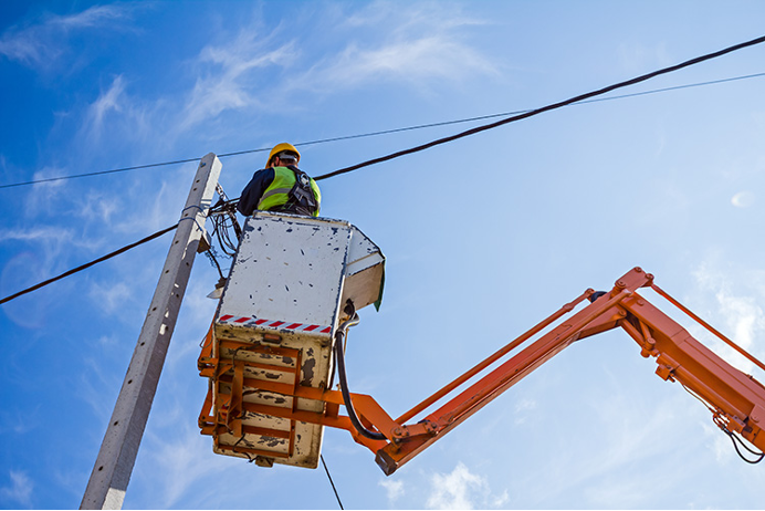 Aerial Lineman: Masters and Guardians of Telecommunications and the Grid - Part I Aerial lineman work at great heights, often in challenging weather conditions.