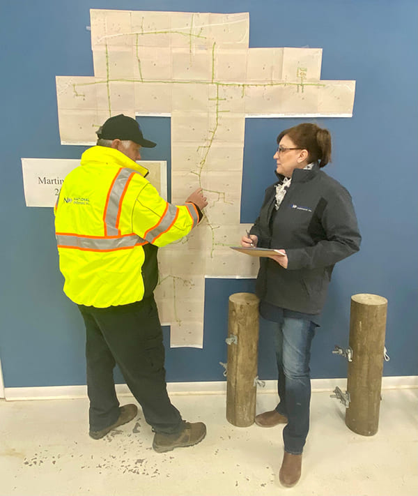 Fiber Optic Boom: Transformative Trends Lighting Up the Future Crew members talking over fiber maps